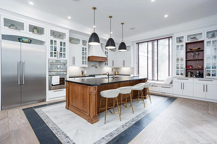 Modern kitchen renovation in North York by GMC Construction Inc., featuring sleek cabinetry, high-end appliances, and a spacious island, designed for both functionality and style to enhance your cooking experience.