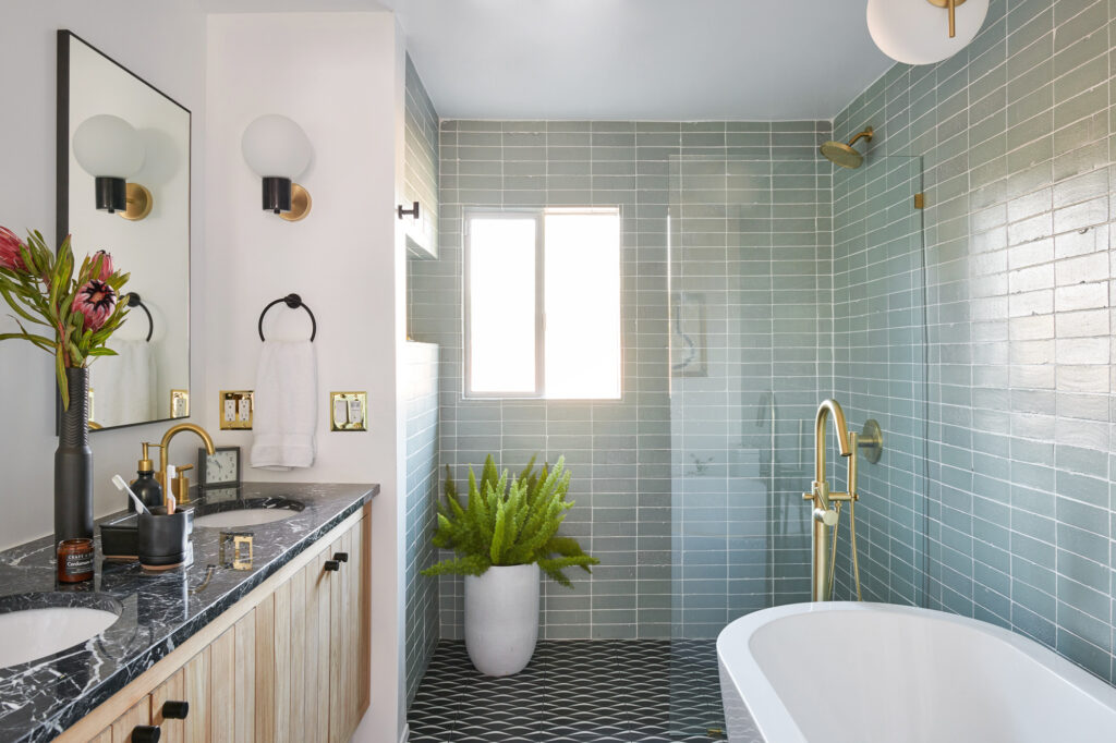 Modern bathroom featuring a sleek design with a freestanding tub, stylish vanity, and contemporary fixtures, expertly renovated by GMC Construction Inc.