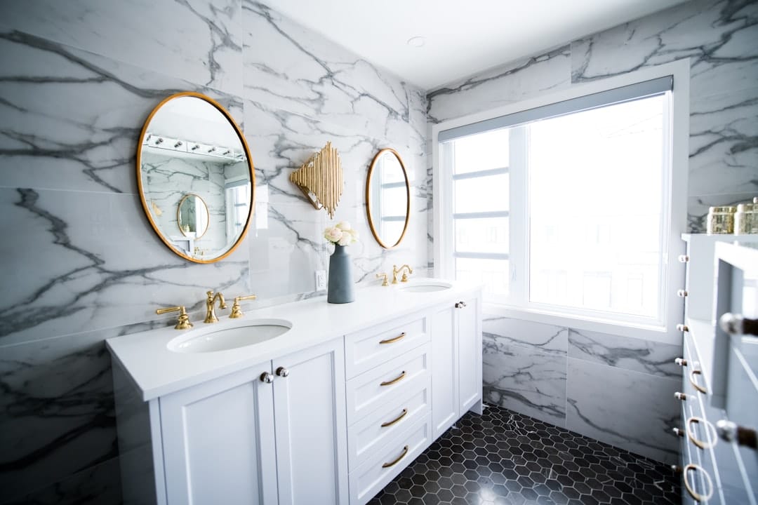 Bathroom renovation by GMC Construction Inc. in Toronto, featuring a modern walk-in shower, sleek fixtures, and elegant tile work.