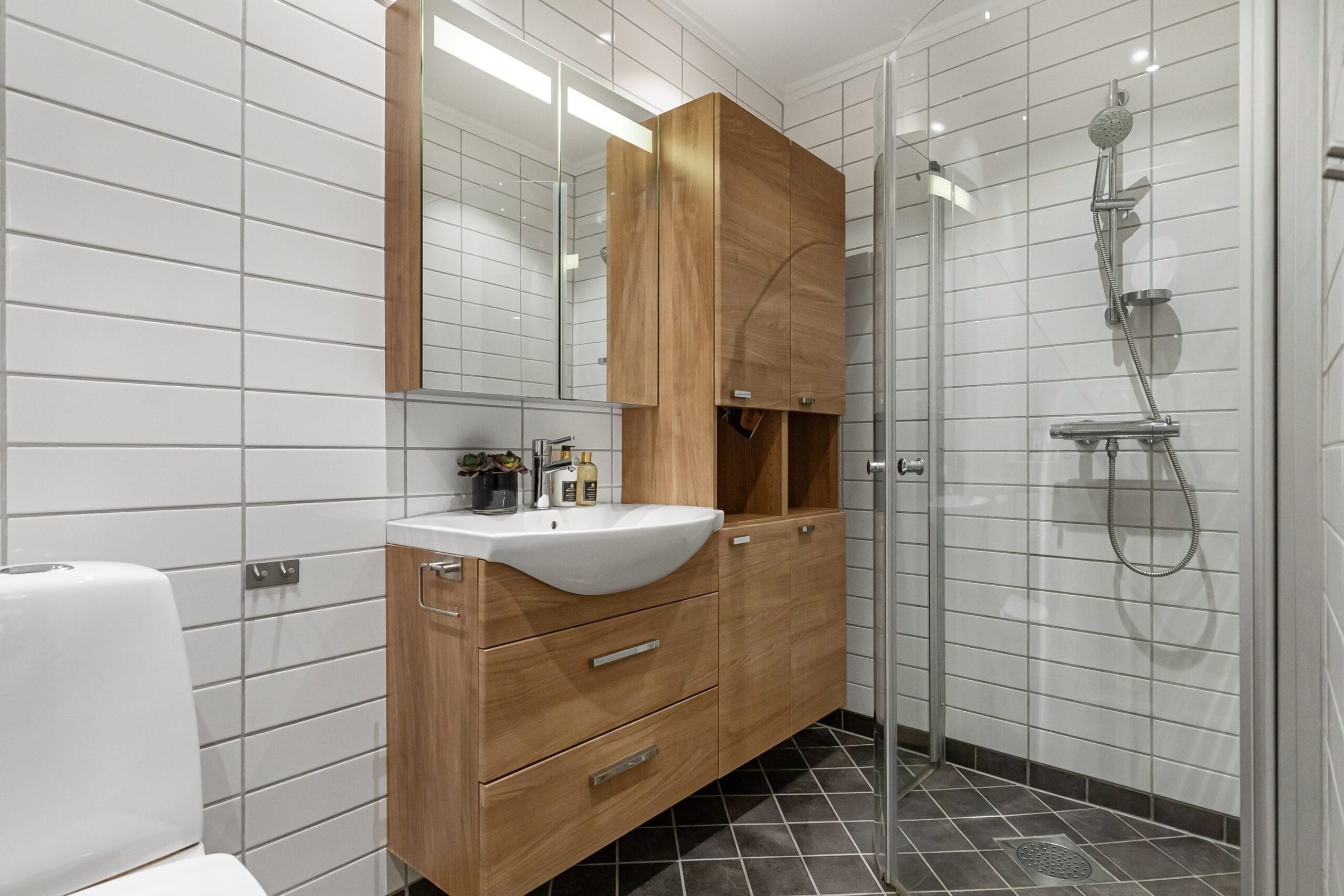 Bathroom renovation by GMC Construction Inc. featuring modern fixtures, a spacious shower, and elegant tile work in a Toronto home.