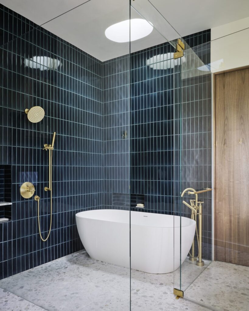 Modern bathroom featuring a sleek design with a freestanding tub, stylish vanity, and contemporary fixtures, expertly renovated by GMC Construction Inc.