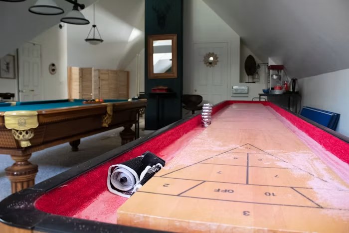 Finished basement set up as a game room